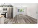 Open-concept living space with stainless steel appliances and natural light at 1500 Buckeye Cir, Georgetown, CO 80444