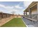 Large backyard with a green lawn and extended porch at 12965 Grassland St, Longmont, CO 80504