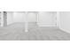 Spacious basement with neutral carpet and freshly painted white walls at 12965 Grassland St, Longmont, CO 80504