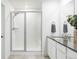 Bright bathroom with white subway tile shower and a gray countertop sink at 12965 Grassland St, Longmont, CO 80504