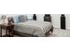Cozy bedroom featuring a comfortable bed, stylish nightstand, and modern speakers at 12965 Grassland St, Longmont, CO 80504