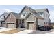 Well maintained two-story home with stone accents, two-car garage, and landscaped front yard at 12965 Grassland St, Longmont, CO 80504