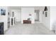 Hallway featuring a wooden bench with neutral accents and multiple doorways at 12965 Grassland St, Longmont, CO 80504