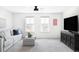 Bright living room with plush sofa, neutral colors, and a ceiling fan for a relaxed atmosphere at 12965 Grassland St, Longmont, CO 80504