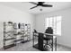Office space with modern desk, rolling chair, and open shelving at 12965 Grassland St, Longmont, CO 80504