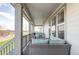 Relaxing porch with comfortable outdoor seating and stylish lighting at 12965 Grassland St, Longmont, CO 80504