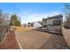 Spacious backyard with wooden fencing and a large, blank canvas of land for landscaping at 5773 W 76Th Dr, Arvada, CO 80003