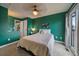 Bedroom featuring neutral decor, plush carpeting, and natural light, providing a peaceful and inviting atmosphere at 5773 W 76Th Dr, Arvada, CO 80003