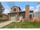 Charming two-story home with brick accents, garage, and well-manicured front lawn at 5773 W 76Th Dr, Arvada, CO 80003