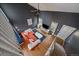 Bright living area showcasing high ceilings, modern furniture, and ample natural light from large windows at 5773 W 76Th Dr, Arvada, CO 80003