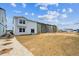 New home construction with a recently graded backyard showcasing potential for outdoor living and landscaping at 2186 Flower Blossom Ave, Brighton, CO 80601