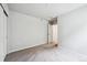 A bedroom with plush carpeting, neutral colors, and a doorway leading to an adjacent room at 2186 Flower Blossom Ave, Brighton, CO 80601