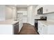 Bright kitchen with white cabinets, stainless steel appliances, and a large island at 2186 Flower Blossom Ave, Brighton, CO 80601
