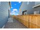 Small back yard featuring a wood fence and gravel for low maintenance at 730 Cottonwood Ave, Bennett, CO 80102