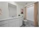 Bright bathroom boasts marble countertops, modern fixtures, and a shower-tub combination at 730 Cottonwood Ave, Bennett, CO 80102