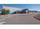 External view of office with a large parking lot, several handicap spaces, and well-kept landscaping at 730 Cottonwood Ave, Bennett, CO 80102