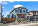 Charming two-story home with a landscaped front yard and inviting front porch at 730 Cottonwood Ave, Bennett, CO 80102