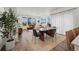 Spacious open concept living area connects seamlessly to dining and living areas with hardwood floors at 730 Cottonwood Ave, Bennett, CO 80102