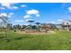 Community playground area with updated equipment, lush green grass, and gathering areas at 730 Cottonwood Ave, Bennett, CO 80102