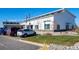 Exterior shot of the Town Hall, which features well-kept lawns, landscaping, and plenty of parking at 730 Cottonwood Ave, Bennett, CO 80102