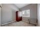 Bright bedroom featuring neutral paint and a large storage cabinet at 10078 Telluride St, Littleton, CO 80125