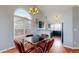 Comfortable dining area with wood floors and lots of natural light from big windows at 10078 Telluride St, Littleton, CO 80125