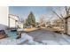 Driveway with parking, front yard and houses across the street at 10078 Telluride St, Littleton, CO 80125