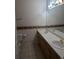 A well-lit bathroom offers a double sink vanity for convenience at 7369 S Alkire St # 203, Littleton, CO 80127