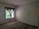 Simple bedroom featuring window with curtains and plenty of natural light at 7369 S Alkire St # 203, Littleton, CO 80127