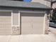 A single-car garage that features stone accents for enhanced curb appeal at 7369 S Alkire St # 203, Littleton, CO 80127