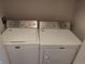 Convenient laundry room featuring a Maytag washer and dryer set for easy laundry access at 7369 S Alkire St # 203, Littleton, CO 80127