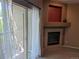 Living room featuring fireplace and sliding glass doors with sheer curtains at 7369 S Alkire St # 203, Littleton, CO 80127