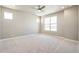 Spacious bedroom featuring plush carpeting, recessed lighting, and a large window with scenic views at 21022 E 63 Dr, Aurora, CO 80019