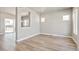 Spacious open-concept living area with wood flooring, offering flexible layout options and natural light at 21022 E 63 Dr, Aurora, CO 80019