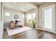 Inviting home office featuring wood floors, natural light, and a comfortable workspace for productivity at 21022 E 63 Dr, Aurora, CO 80019