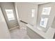 Bright staircase with white walls and multiple windows, offering plenty of natural light at 21022 E 63 Dr, Aurora, CO 80019
