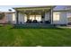 Covered back porch offers a relaxing outdoor living space with a scenic backyard view at 20553 E 50Th Pl, Denver, CO 80249