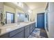 Bathroom featuring double sinks and stylish fixtures providing ample space and functionality at 20553 E 50Th Pl, Denver, CO 80249