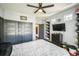 This bedroom includes a closet and a media center for entertainment and storage at 20553 E 50Th Pl, Denver, CO 80249