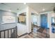 Welcoming foyer showcases modern design elements, hardwood floors, and stylish lighting fixtures at 20553 E 50Th Pl, Denver, CO 80249