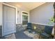 Welcoming front porch area with seating, offers an inviting space to relax and enjoy the neighborhood at 20553 E 50Th Pl, Denver, CO 80249