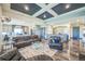 Open-concept living area with hardwood floors connects seamlessly to the kitchen, perfect for entertaining at 20553 E 50Th Pl, Denver, CO 80249
