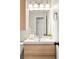A modern bathroom vanity with sleek lines, bright lighting, and minimalist decor at 16012 E Floyd Ave, Aurora, CO 80013