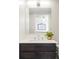 Modern bathroom featuring stainless steel faucet, decor and large mirror at 16012 E Floyd Ave, Aurora, CO 80013