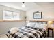 Basement bedroom featuring modern decor, minimalist furnishings and natural light at 16012 E Floyd Ave, Aurora, CO 80013