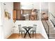 An open dining area and kitchen, with a clear view into the living room at 16012 E Floyd Ave, Aurora, CO 80013