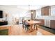 A kitchen with modern appliances and a wooden dining table at 16012 E Floyd Ave, Aurora, CO 80013