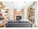 A fireplace surrounded by shelves, creating a cozy and organized living space at 16012 E Floyd Ave, Aurora, CO 80013