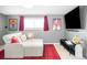 Cozy finished basement featuring a sectional couch, media console and accent rug at 16012 E Floyd Ave, Aurora, CO 80013