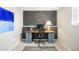 Bright office space features a large desk, track art, and carpet at 16012 E Floyd Ave, Aurora, CO 80013